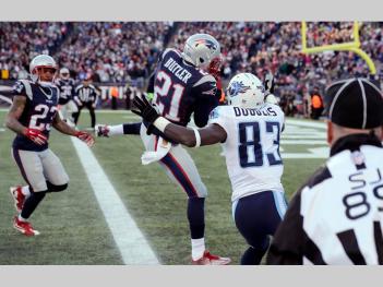 Malcolm Butler had a big game, including this interception in the end zone in front of Harry Douglas (83) (AP Photo/Charles Krupa)