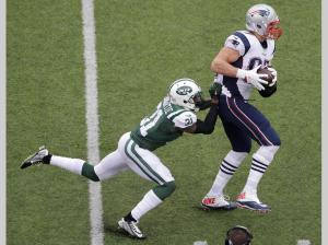 No one takes Rob Gronkowski (87) down one on one ( New York Jets' Antonio Cromartie (31) (AP Photo/Peter Morgan)